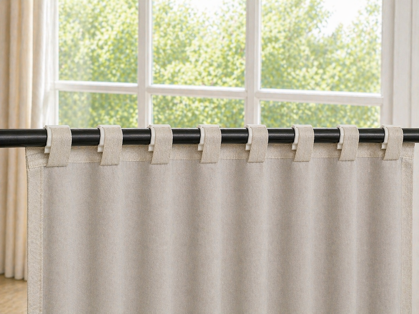 8 SilkSlide clips evenly spaced on curtain rod, perfect pleat spacing